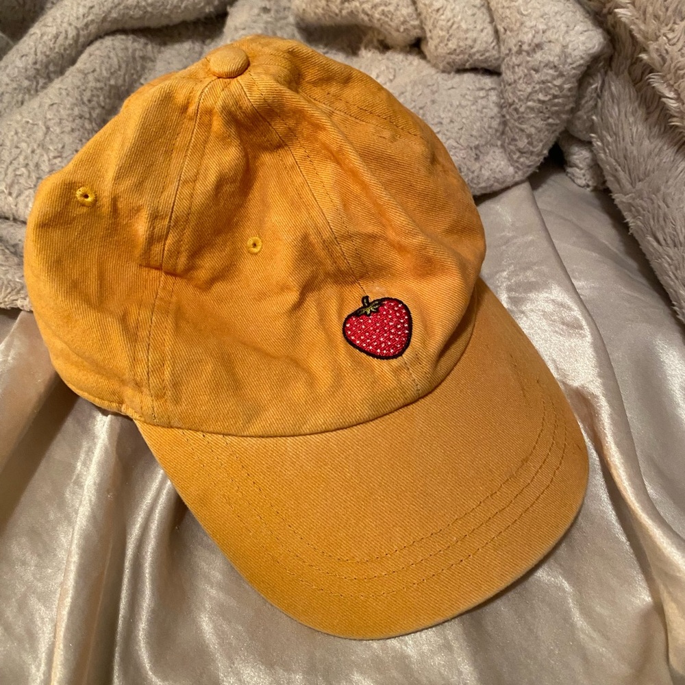 yellow ball cap with embroidered strawberry